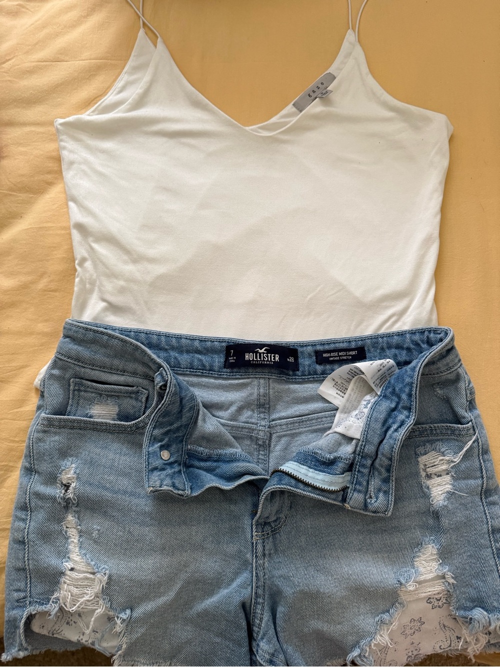 Hollister White V-Neck Camisole with Light Blue Distressed Denim Shorts and body